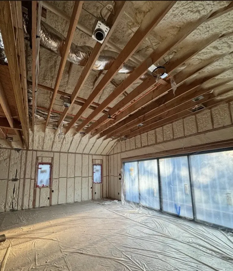 Interior walls and ceiling insulated with spray foam during new construction in Paterson